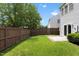 Spacious and grassy backyard with wood fence and patio at 107 Caraleigh Ct, Morrisville, NC 27560