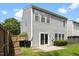 Two-story home with a fenced backyard, small patio, and vinyl siding at 107 Caraleigh Ct, Morrisville, NC 27560