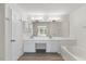 Bright primary bathroom with double sink vanity and bathtub at 107 Caraleigh Ct, Morrisville, NC 27560