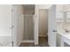 Bathroom featuring a walk-in shower, vanity mirror and single sink vanity at 107 Caraleigh Ct, Morrisville, NC 27560