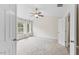 Bright bedroom featuring a ceiling fan and natural light from the window at 107 Caraleigh Ct, Morrisville, NC 27560