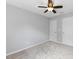 Bright bedroom featuring neutral walls, carpet, and ceiling fan at 107 Caraleigh Ct, Morrisville, NC 27560