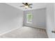 Bright bedroom with a ceiling fan and large window that brings in natural light at 107 Caraleigh Ct, Morrisville, NC 27560