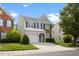 Charming two-story home featuring blue shutters, a one-car garage, and a well-maintained lawn at 107 Caraleigh Ct, Morrisville, NC 27560