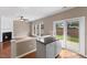 Living room with granite bar, fireplace, sliding doors to back yard, and large bright windows at 107 Caraleigh Ct, Morrisville, NC 27560
