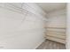 Walk-in closet with shelving installed and neutral carpet at 107 Caraleigh Ct, Morrisville, NC 27560