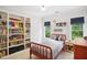 Comfortable bedroom with built-in shelves, natural light and stylish decor at 1102 Whiston Dr, Apex, NC 27502