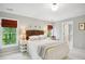Comfortable main bedroom with natural light, neutral colors and stylish furnishings at 1102 Whiston Dr, Apex, NC 27502
