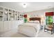 Serene main bedroom with custom built-ins, two windows and neutral decor at 1102 Whiston Dr, Apex, NC 27502