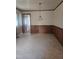 A clean dining area with wood paneled wainscoting and simple overhead lighting fixture at 1157 S Cambridge Cir, Rocky Mount, NC 27801