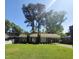 Charming single-story brick home featuring a well-manicured front yard and covered parking area at 1157 S Cambridge Cir, Rocky Mount, NC 27801