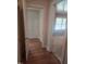 Inviting hallway with gleaming hardwood floors leads to well-lit rooms at 1157 S Cambridge Cir, Rocky Mount, NC 27801
