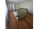 Sunlit living room with hardwood floors and plush couches, creating a welcoming atmosphere at 1157 S Cambridge Cir, Rocky Mount, NC 27801