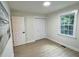 Neutral bedroom with laminate flooring, double door closet and sunny window at 116 Lumpkin St, Raleigh, NC 27610