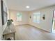 Well-lit living room with wood floors, bright windows, and neutral decor creating a cozy ambiance at 116 Lumpkin St, Raleigh, NC 27610