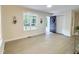 Bright and open living space featuring wood floors, updated windows, and a stylish black front door at 116 Lumpkin St, Raleigh, NC 27610