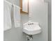Cozy bathroom featuring classic fixtures, a corner sink, and fresh white towels at 12 Byerly Ct, Durham, NC 27713
