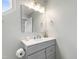 Updated bathroom boasts a gray vanity and a stylish, well-lit mirror at 12 Byerly Ct, Durham, NC 27713