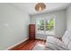 Comfortable bedroom featuring a futon and large windows at 12 Byerly Ct, Durham, NC 27713