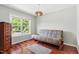 Inviting bedroom with hardwood floors and large window for natural light at 12 Byerly Ct, Durham, NC 27713