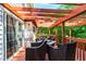 Inviting wood deck with ample seating and a trellis, perfect for entertaining at 12 Byerly Ct, Durham, NC 27713