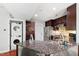 Well-equipped kitchen with stainless steel appliances, sleek cabinetry, and granite countertops at 12 Byerly Ct, Durham, NC 27713
