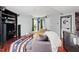 Comfortable living area with a sofa, entertainment center, and views of the backyard and kitchen at 12 Byerly Ct, Durham, NC 27713