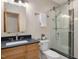 Bathroom boasts a glass shower, a floating shelf, and a single sink vanity at 120 Spring Hollow Ln, Cary, NC 27518