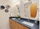 Bathroom with double vanity, modern faucets, and decorative accents at 120 Spring Hollow Ln, Cary, NC 27518