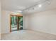 Bright bedroom features neutral carpeting and a glass sliding door leading to the outdoors at 120 Spring Hollow Ln, Cary, NC 27518