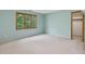 Bright bedroom featuring a large window overlooking the lush greenery at 120 Spring Hollow Ln, Cary, NC 27518