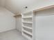 Walk-in closet with custom shelving and ample storage space at 120 Spring Hollow Ln, Cary, NC 27518