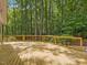Spacious wooden deck offers views of the peaceful wooded area, perfect for outdoor entertaining and relaxation at 120 Spring Hollow Ln, Cary, NC 27518