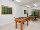 Spacious game room with a foosball table and pool table for indoor entertainment at 120 Spring Hollow Ln, Cary, NC 27518