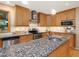 Traditional kitchen featuring stainless appliances, granite countertops, and wood cabinetry at 120 Spring Hollow Ln, Cary, NC 27518
