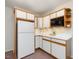 Efficient kitchen design with white cabinets, under cabinet lighting, and a microwave at 120 Spring Hollow Ln, Cary, NC 27518