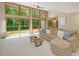 Bright living room with a large windows, a deck, neutral tones and comfortable seating at 120 Spring Hollow Ln, Cary, NC 27518