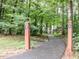 Picturesque walking trail through a lush, green forest, inviting for outdoor recreation and nature enjoyment at 120 Spring Hollow Ln, Cary, NC 27518