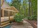 Charming walkway and spacious deck provide seamless indoor-outdoor living, perfect for enjoying nature at 120 Spring Hollow Ln, Cary, NC 27518
