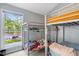 Bedroom featuring a full size bunk bed, a large picture window and neutral paint colors at 135 Sagamore Dr, Louisburg, NC 27549