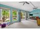 Living room featuring water views, light blue walls, and access to a private outdoor space at 135 Sagamore Dr, Louisburg, NC 27549