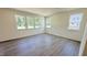 Bright bedroom with hardwood floors and multiple windows providing ample natural light at 147 Gobbler Dr, Smithfield, NC 27577