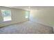 Spacious bedroom featuring plush carpeting and natural light, creating a comfortable and welcoming ambiance at 147 Gobbler Dr, Smithfield, NC 27577