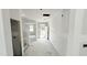 Unfinished hallway featuring a staircase and multiple windows at 147 Gobbler Dr, Smithfield, NC 27577