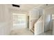 Unfinished home interior showcasing staircase, and multiple windows at 147 Gobbler Dr, Smithfield, NC 27577