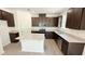 Modern kitchen featuring dark cabinets, stainless steel appliances, granite countertops, and a kitchen island at 147 Gobbler Dr, Smithfield, NC 27577