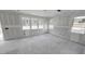 Unfinished living room featuring three large windows and natural light at 147 Gobbler Dr, Smithfield, NC 27577