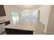 Open-concept living room with hardwood floors, natural light, and a view of the backyard at 147 Gobbler Dr, Smithfield, NC 27577