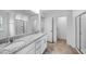 Bathroom featuring double sinks with granite countertops, tile flooring, and separate room for toilet and shower at 174 Hickory Grove Dr, Sanford, NC 27330