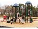 Community playground with slides, climbing structures, and a safe play area for children to enjoy at 174 Hickory Grove Dr, Sanford, NC 27330